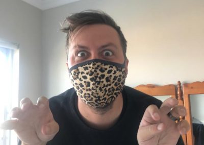 Christpher accidentally bought a mask with cheetah print